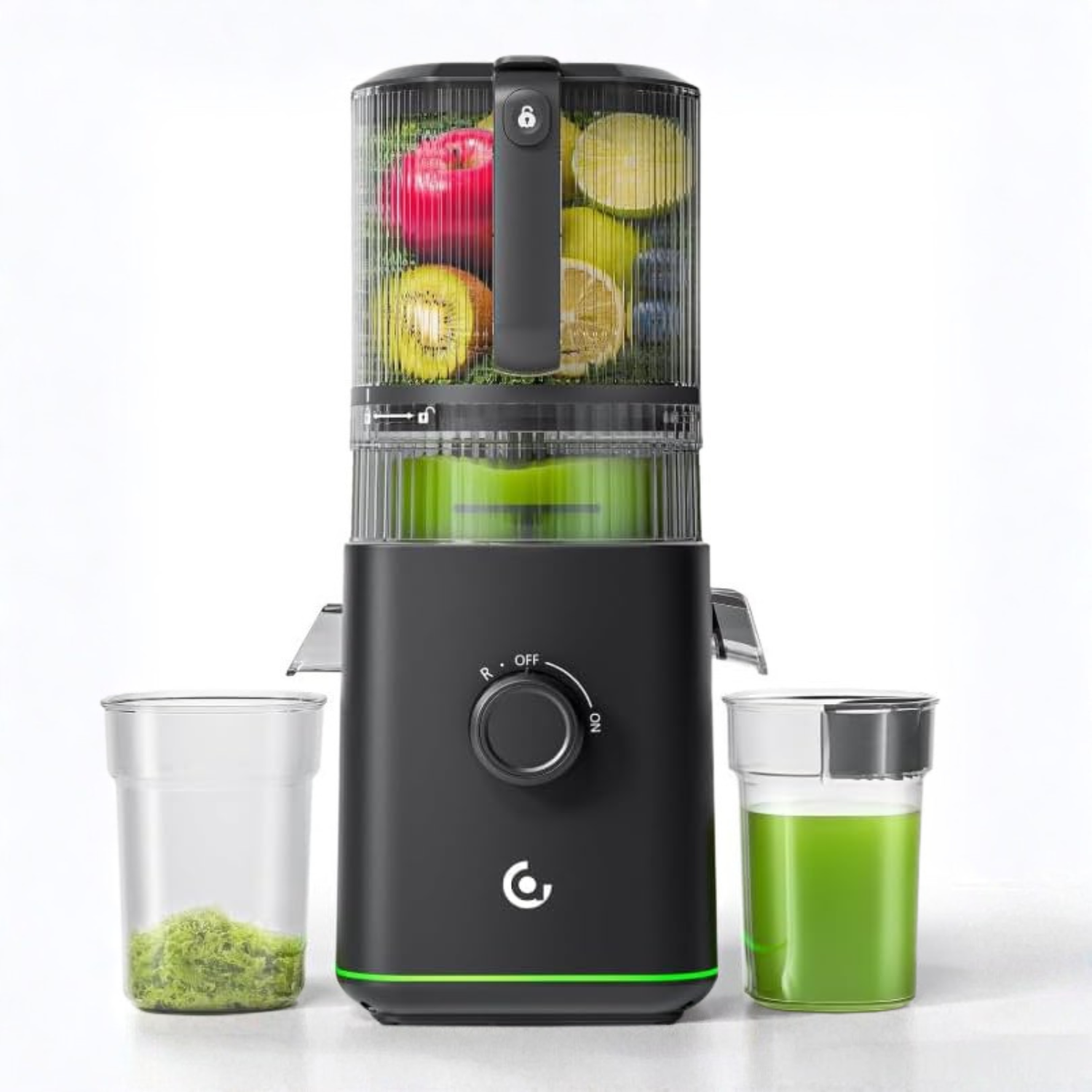 Black juice extractor with fruits and a glass of green juice